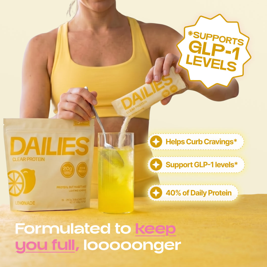 Person pouring and stirring Dailies Lemonade powder into a yellow drink. Graphic claims longer fullness, reduced cravings, GLP-1 support and 40% daily protein. #flavor_lemonade